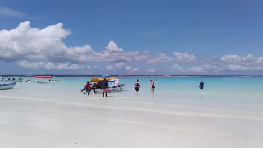 Zanzibar: Mnemba Atoll Marine Reserve Snorkeling Tour - A sandbank stop with fruit and photographs